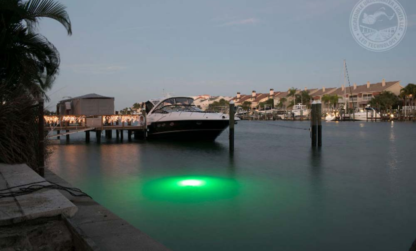 A green-colored LED light next to a small ship.