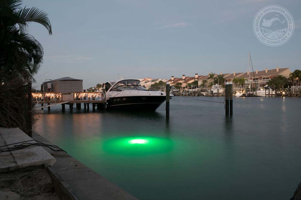 A white colored boat parked on the water body.