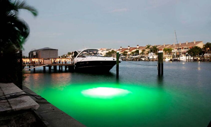 A green colored LED light underwater.
