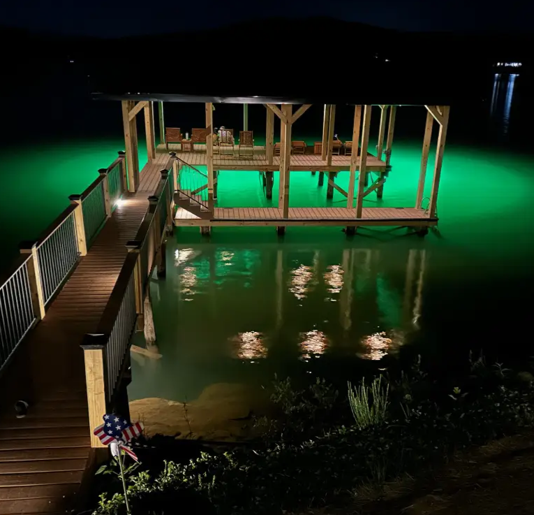 A dock area with modern fixtures and underwater LED lights.