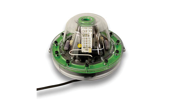 A green colored LED light with a wire attached. 