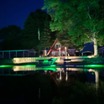 A large open area space with green underwater LED lights.