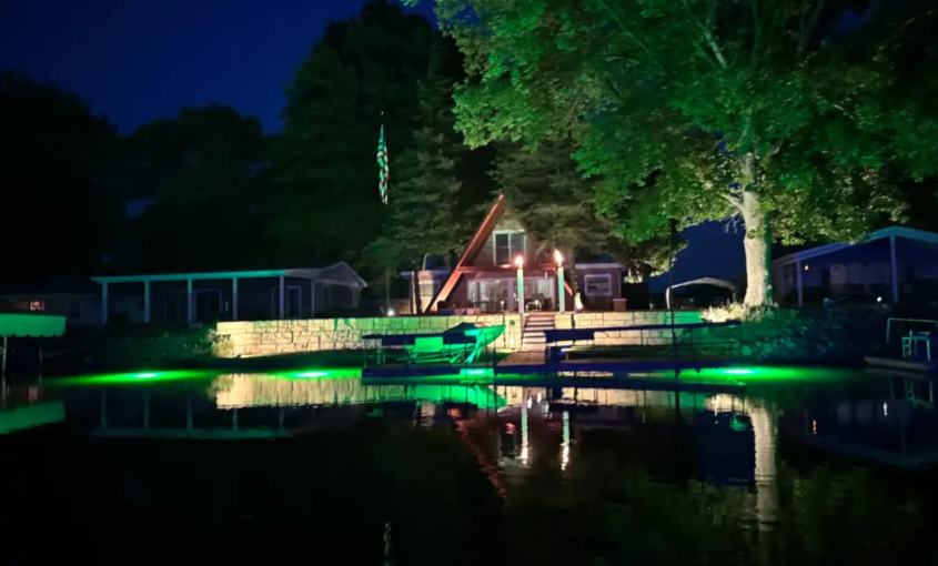 A large open area space with green underwater LED lights.