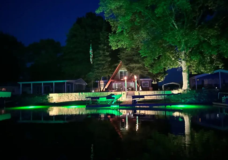 A beach front property with green underwater LED light.