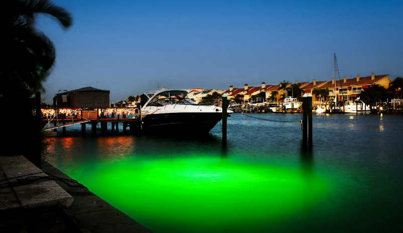 A boat parked near a dock on the waters.