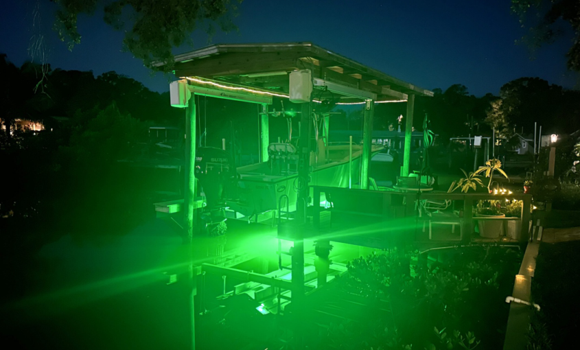 A large space with underwater green lights.