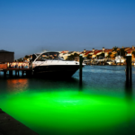 A boat parked next to the dock.