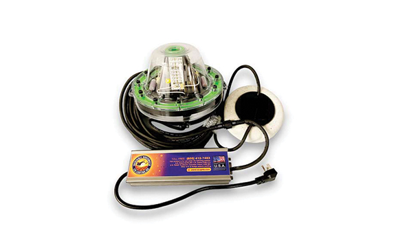  A green colored underwater LED light with wires and batteries. 